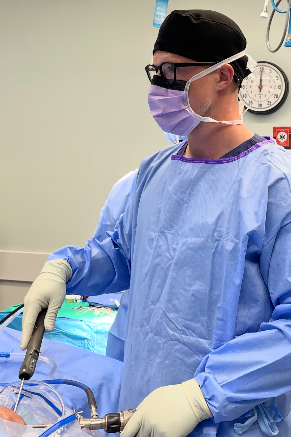 Dr. Josiah Valk performing orthopedic surgery in a hospital operating room