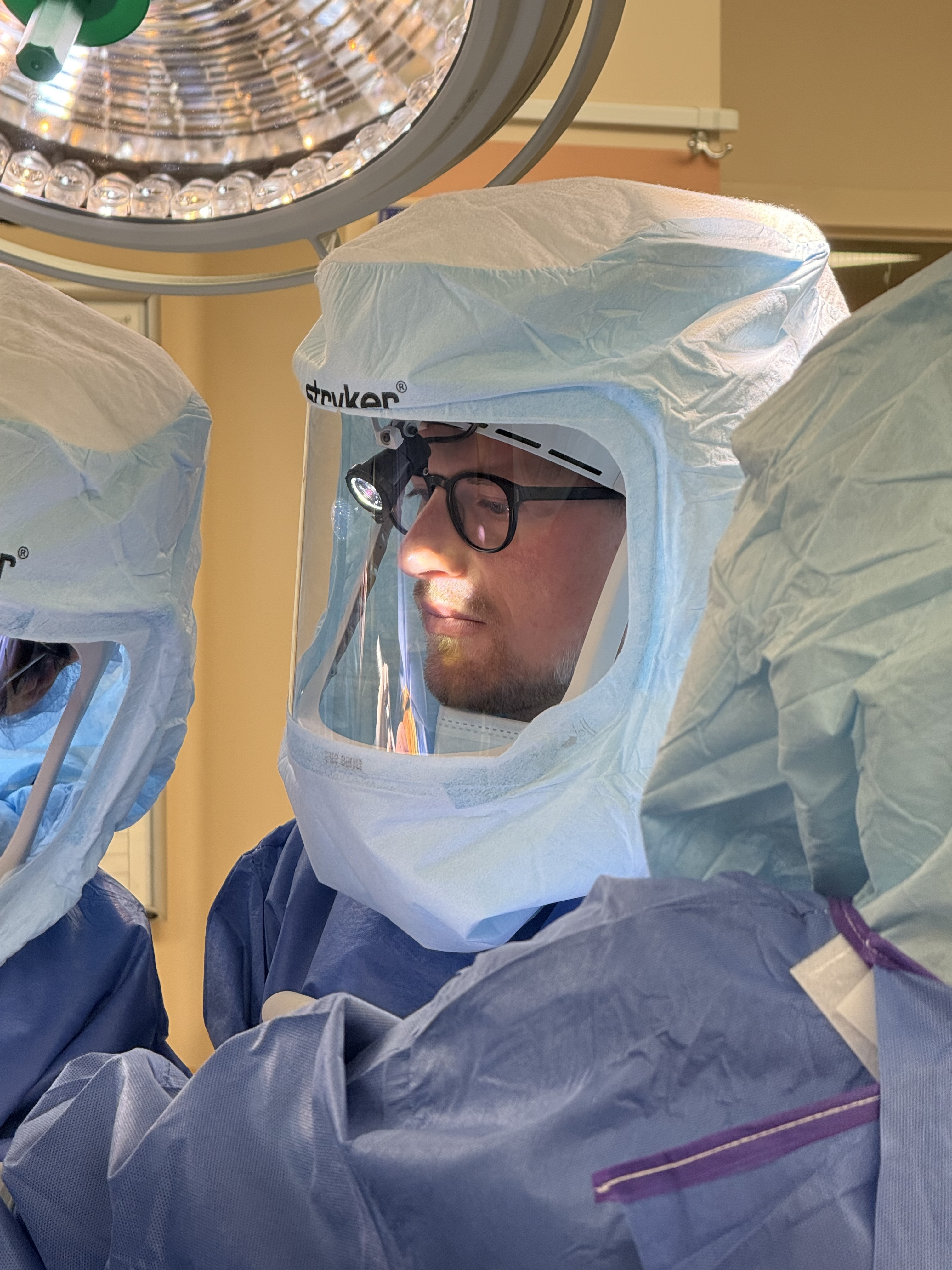 Dr. Josiah Valk performing orthopedic surgery in a hospital operating room