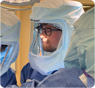 Dr. Josiah Valk performing orthopedic surgery in a hospital operating room