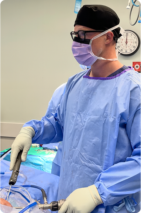 Dr. Josiah Valk performing orthopedic surgery in a hospital operating room